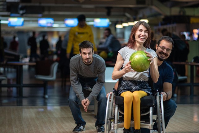 Smiley Face Disabled Girl With Support Worker