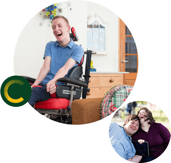 A man and woman with disabilities sitting close and laughing and a man with a disability in a wheelchair laughing