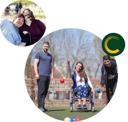 Claro-Victoria1 A man and woman with disabilities sitting close and laughing and three people tossing balls, two men to the right and left and a woman in the center in a wheelchair