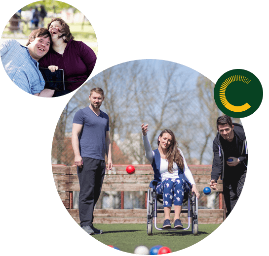 A man and woman with disabilities sitting close and laughing and three people tossing balls, two men to the right and left and a woman in the center in a wheelchair