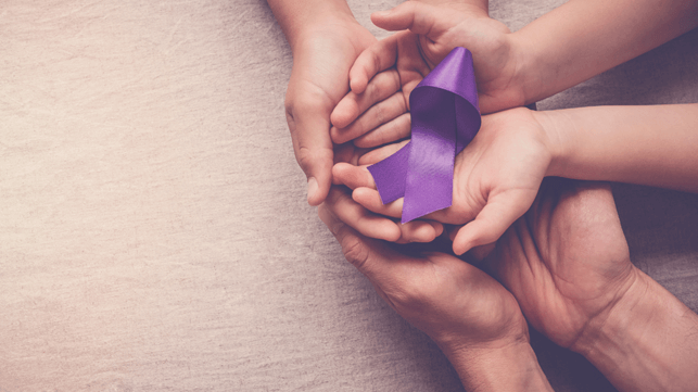 Purple Ribbon held in 2 pairs of hands